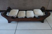 Vintage wooden serving tray with four ramekins