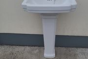 Bathroom sink with pedestal, taps and trap
