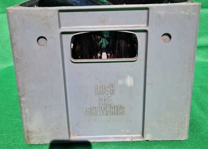 24 Antique 1/2 pint bottles in crate