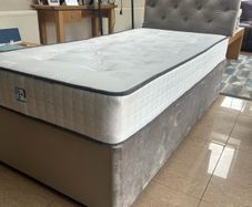 Two single beds with mattresses and headboards