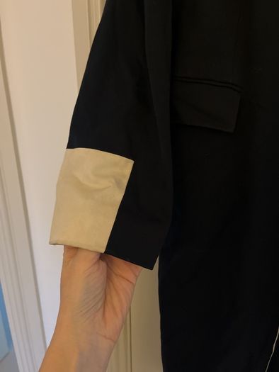 Black and cream coat