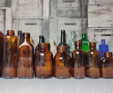 316 - Set of 9 Different Sizes Amber Glass Collectible Decorative Bottles and Jars