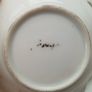 Small porcelain lustre trinket plate depicting Hound with sign Foreign at the back  D 9.5cm Image 2