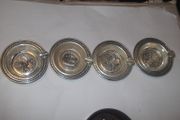 4 vintage small silver plated  ash trays in a bakelite  box