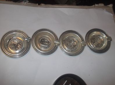 4 vintage small silver plated  ash trays in a bakelite  box