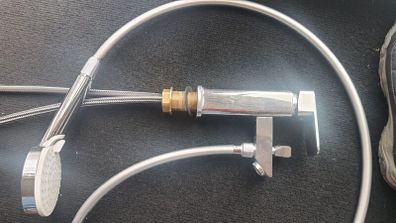 Bath tap with a shower head