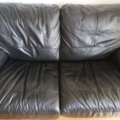 Black leather two-seater sofa