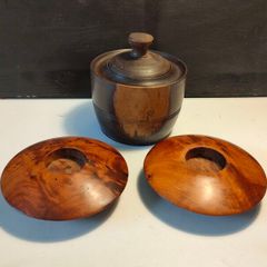 A pair of Burr Walnut tea light holders and burr lidded container