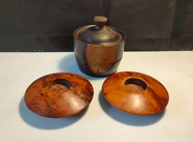A pair of Burr Walnut tea light holders and burr lidded container