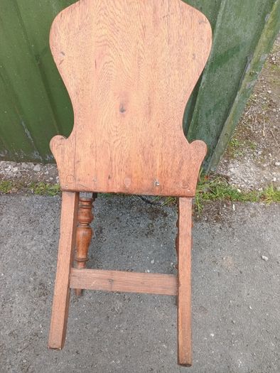 two oak chairs and an old  card table