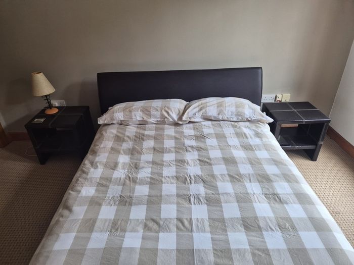 Double bed with mattress and two side tables