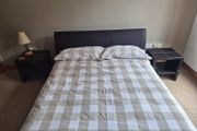 Double bed with mattress and two side tables