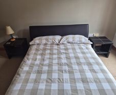 Double bed with mattress and two side tables
