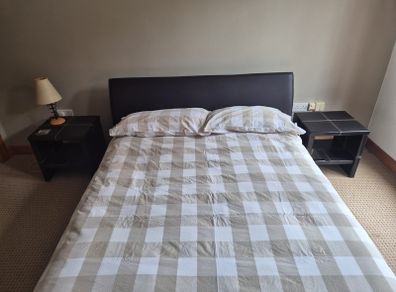 Double bed with mattress and two side tables