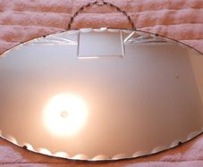 Vintage Art Deco Mirror. Scalloped bevelled edge frameless round wall mirror. Ready to hang on original visible chain. 25" x 15"