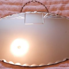 Vintage Art Deco Mirror. Scalloped bevelled edge frameless round wall mirror. Ready to hang on original visible chain. 25" x 15"