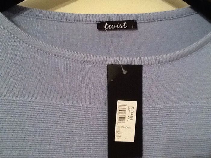 Light blue short jumper. 'Twist' brand
