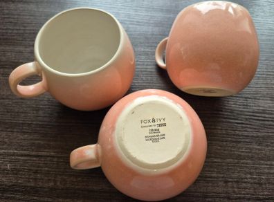 three round pink cups