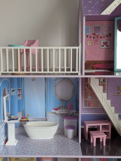 Large wooden dolls house with furniture