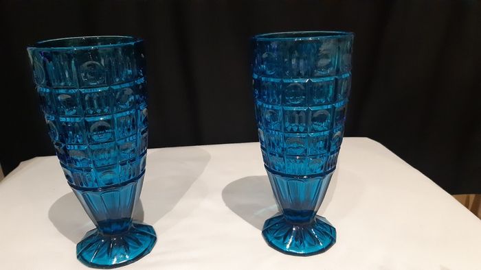 A pair of blue/deep turquoise glass vases