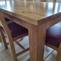 Solid oak dining table + 6 solid oak chairs .