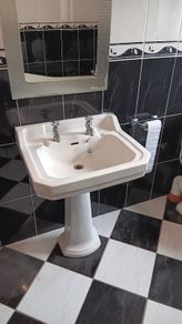Sink with pedestal