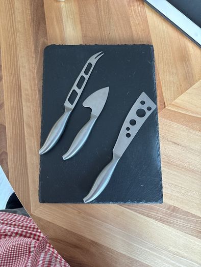cheese board with cheese knives