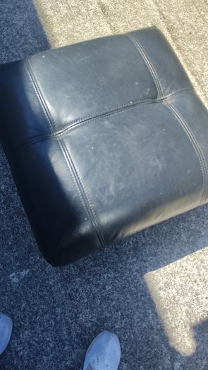 black leather footstool