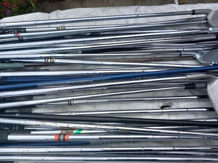A selection of golf clubs and bags. NOT SELLING SEPARATE
