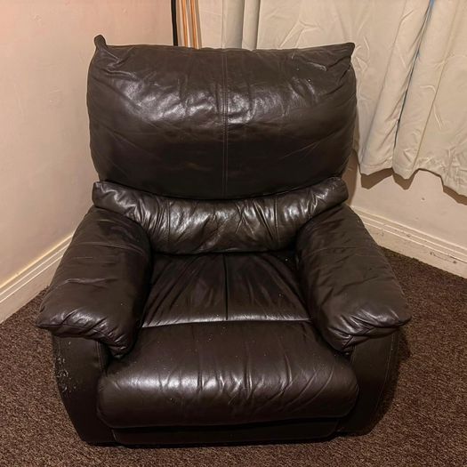 black leather sofa and arm chairs