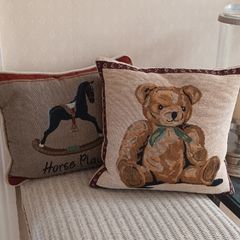 Pair of Nursery Cushions.