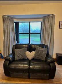 Black leather recliner suite