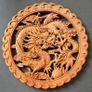 Carved decorative wooden plaque, featuring dragons. Image 2