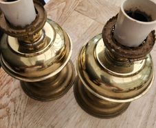 a lovely pair of old brass lamps