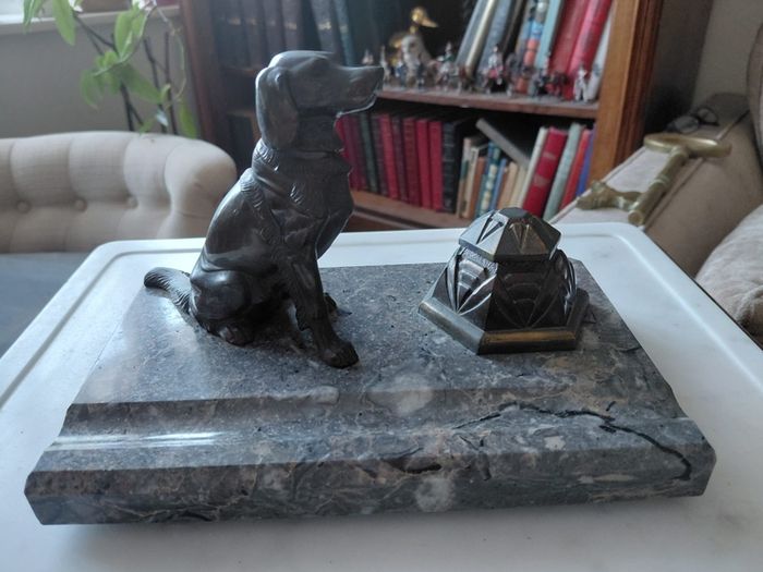 Antique desk inkwell with a seated dog on marble stand