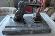 Antique desk inkwell with a seated dog on marble stand
