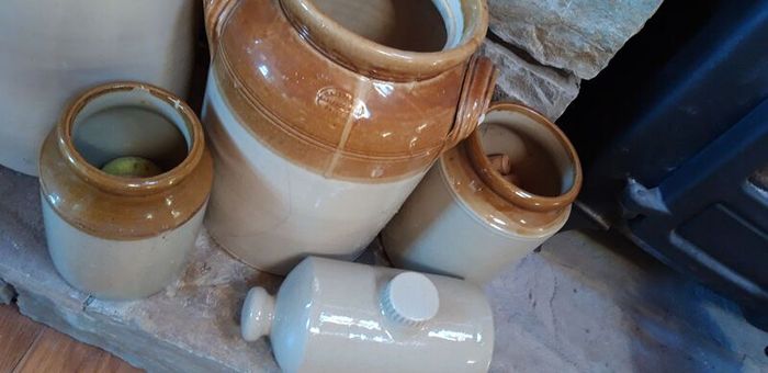 Collection of Eight Antique Stoneware Jars including Two Antique Hot Water Bottles