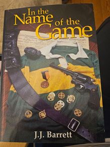 In The Name Of The Game. By J.j. Barrett. First Edition Paperback In Good Condition.  See Photos For Same.