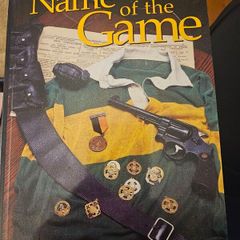 In The Name Of The Game. By J.j. Barrett. First Edition Paperback In Good Condition.  See Photos For Same.
