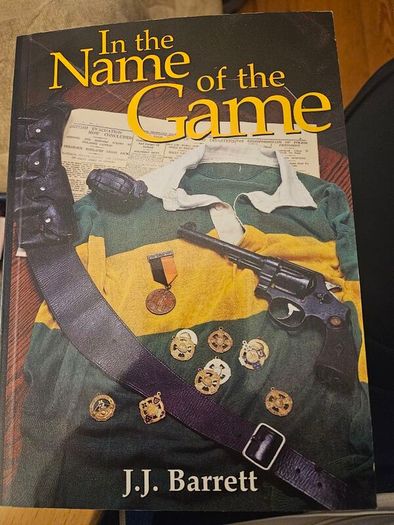 In The Name Of The Game. By J.j. Barrett. First Edition Paperback In Good Condition.  See Photos For Same.