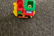 Toy train set with track and trailer