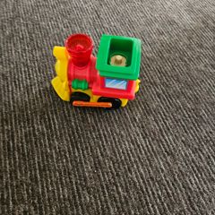 Toy train set with track and trailer