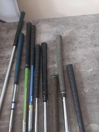 A selection of junior golf clubs and bag.