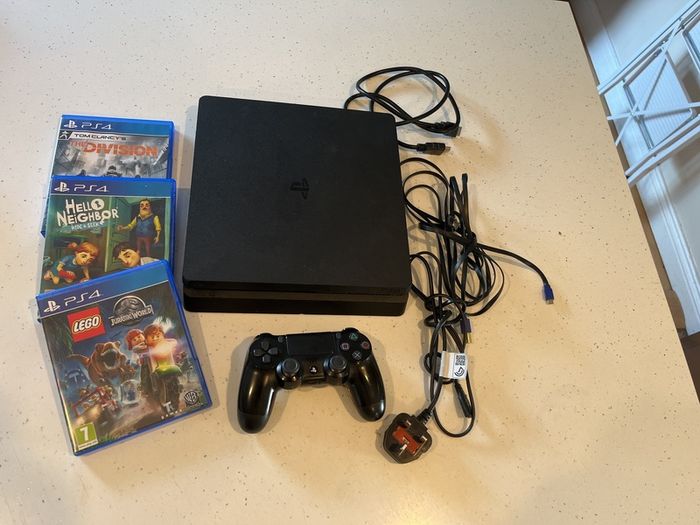 PS4 Slim 1 TB storage version with games and controller