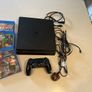 PS4 Slim 1 TB storage version with games and controller Image 3
