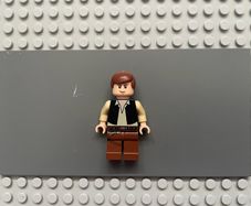 lego Star Wars sw0179 Han Solo minifigure- Black Vest over Tan Shirt, Reddish Brown Legs with Belts, Eyes with Glints