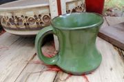 green pottery mug