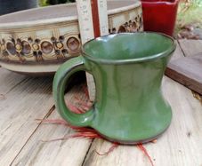 green pottery mug