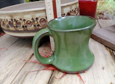 green pottery mug