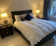 king size bed with matching lockers and lamps